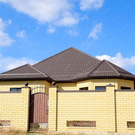 cover brick with corrugated metal 70's house|metal roof for brick house.